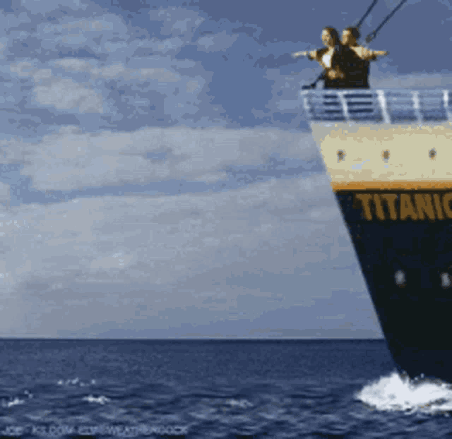 the titanic cartoonishly hitting an iceberg and then two people falling off the boat and sliding into the water