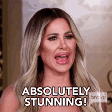 A blonde woman saying ABSOLUTELY STUNNING!