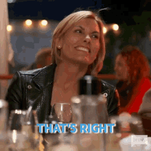 a woman smiling at a table saying "That's right"