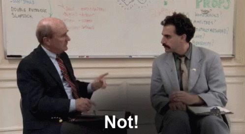 A man with dark hair, a moustache, and a gray suit says, "Not!" to a balding man in a dark suit and red tie.