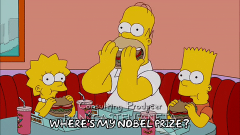 Gif mostra Lisa, Homer e Bart Simpsons comendo e a legenda: Where's my Nobel Prize? (onde está meu prêmio Nobel?)