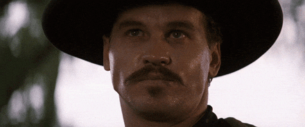 A sick man with a black moustache and black wide-brimmed hat saying, "Oh, I wasn't quite as sick as I made out."