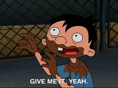 A cartoon boy with black hair, a blue shirt, and chococlate smears on his hands, mouth, and shirt saying, "Give me it, yeah."