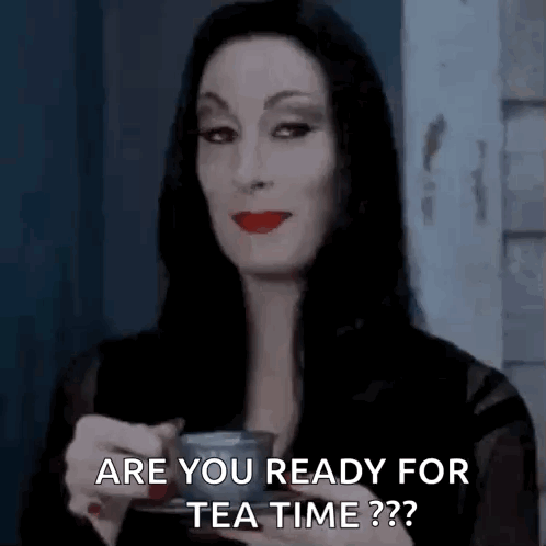 A woman raising a glass to her mouth saying "Are you ready for tea time?"