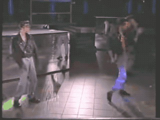 Animated GIF of three men dancing in a club, from Rhythm Device's 'Acid Rock' video