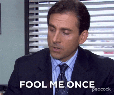 A man in a dark suit and tie saying, "Fool me once, strike one. But fool me twice, strike three."