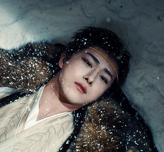 gif of Yichen from Fangs of Fortune being sad an emo laying in the snow like he won't move until he dies there