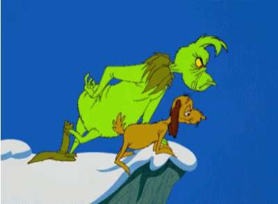 An animated Grinch and dog looking over the edge of a snow-capped peak