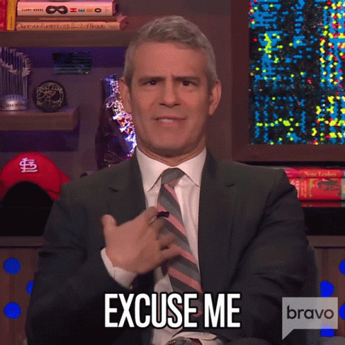 a man in a suit with the words excuse me