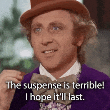 A man in a hat and purple suit says "the suspense is terrible i hope it'll last"