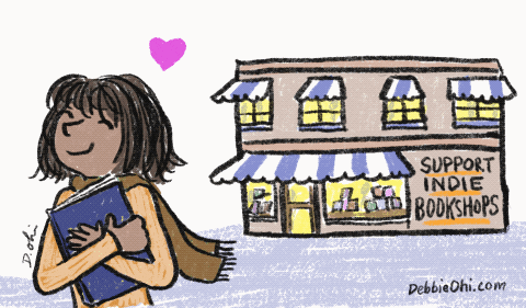 a woman holding a book in front of a bookstore