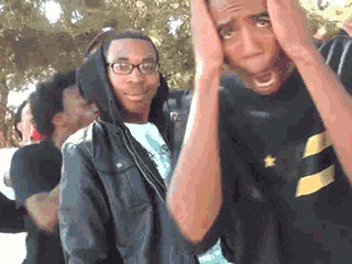 A guy going past the camera, hands on the side of his head in shock (the I'm not a rapper meme).