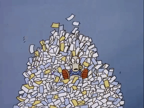 A cartoon wallaby falls into a large pile of letters that is being sorted through a machine.
