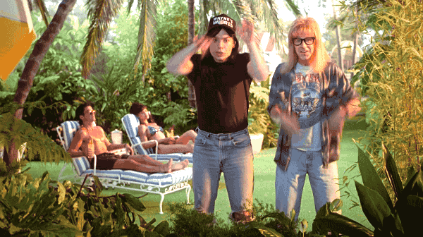 An animated gif of Mike Myers and Dana Carvey as their "Wayne's World" characters making arm waving gestures that make the gif wobble into dreamlike state.