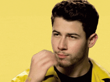 Nick Jonas making a chef's kiss motion