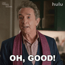 a man wearing a scarf and saying oh good