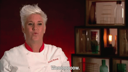 a woman in a chef's uniform saying "Woooooow"