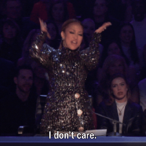 A woman in a sparkly dress dancing wildly and saying "I don't care, I'm killing the dance!"