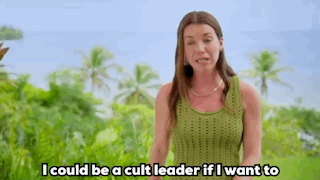 a woman in a green shirt with the caption i could be a cult leader if i want to