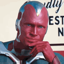 A man with a red head and hand gesturing as if to say, WTF?