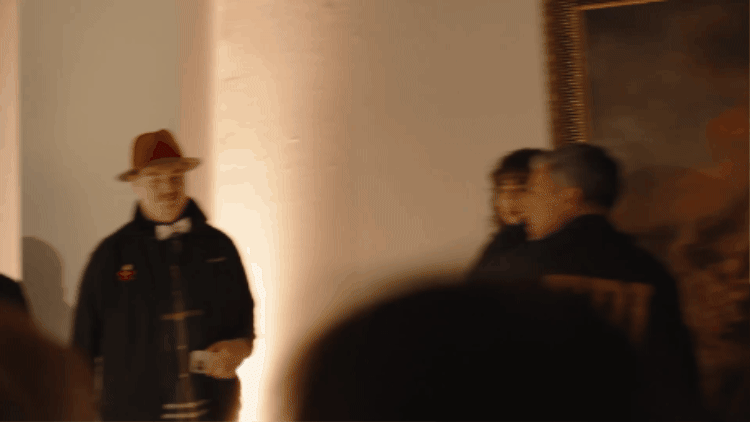 “FBI Agents” carry a “Rembrandt” through the gallery