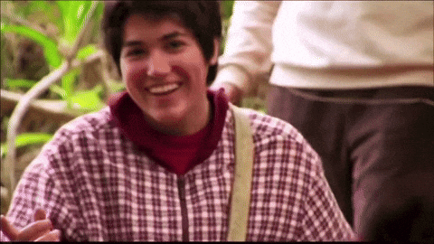A person walking through the jungle, smiling