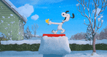Snoopy dancing on the roof of a snow-covered dog house with Woodstock flying around