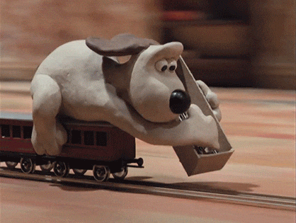 Gif mostra cachorro construindo trilhos enquanto o trem anda
