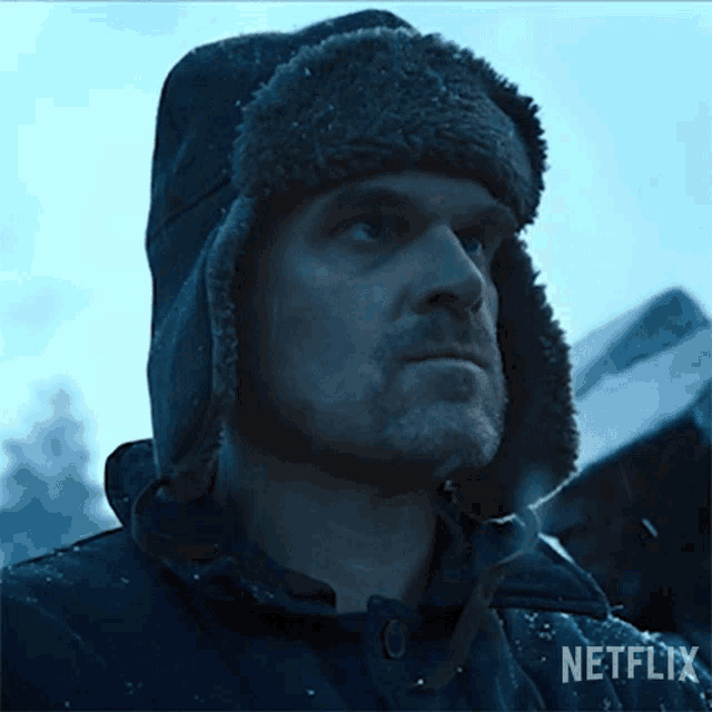 a man in a winter hat saying YOU PROMISED ME