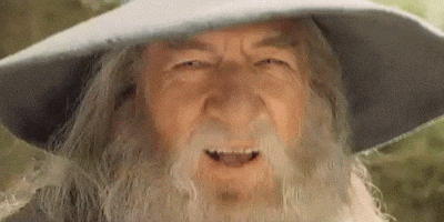 Gandalf (from Lord of the Rings) smiling and bobbing his head.