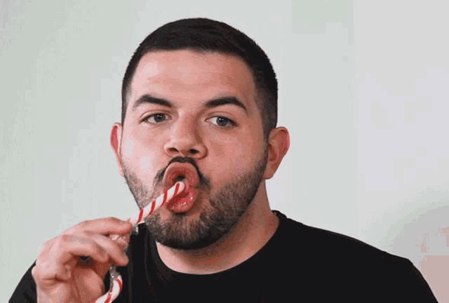 a man eating a candy cane