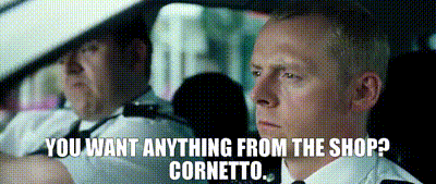 a gif of two police officers parking up. One asks 'you want anything from the shop?' and the other says 'cornetto'.
