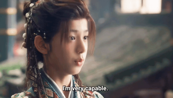 gif from Cdrama Fangs of Fortune, a young man with cute bangles in his pony tail points at himself with his thumb and says "I'm very capable"