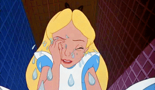 A blonde girl in a blue and white dress, profusely crying massive teardrops.