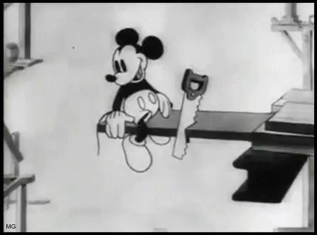 Mickey Mouse sitting on a board and sawing it off
