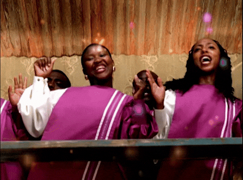 Black female choir members dancing to song