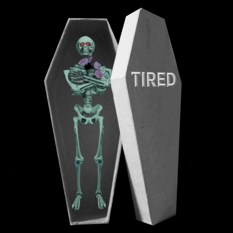 An animation of a skeleton sleeping in a coffin with cartoon "Zzz"s. The coffin lid is labeled "tired"