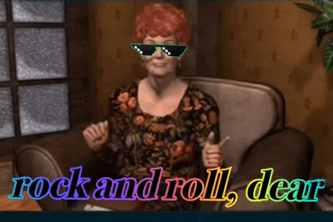 A character from the game, an old woman, with sunglasses superimposed on her face. Text at the bottom reads "rock and roll, dear." The text shifts in color from left to right in a rainbow effect.