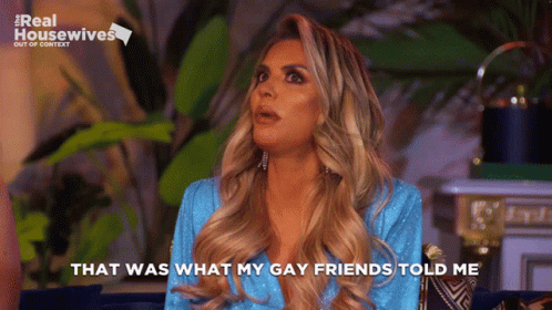 a woman in a blue dress saying "That was what my gay friends told me"