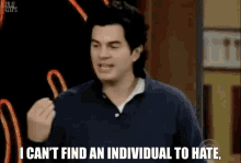A person talks to a group of people and says, 'I can't find an individual to hate, cuz I hate you all'