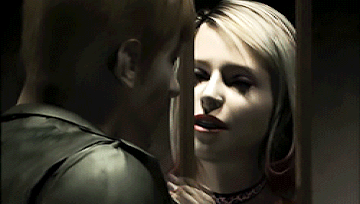 Maria reaching through prison bars to touch James' face